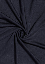 Effortless to style and incredibly comfortable to wear, with a subtle sheen. The medium-thick weight is soft, breathable, fully opaque and durable. Jersey works well in all climates, can be worn without an under scarf or pins, and makes a great option for working out. Navy blue.