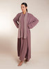 This elegant Two Piece Open Abaya set includes a Full Sleeve matching inner dress. Perfect for everyday wear, it can also be dressed up with accessories for an evening look. The open abaya can be worn as a maxi on its own or paired with the inner dress for a stylish ensemble. In purple.