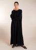 This elegant Two Piece Open Abaya set includes a Full Sleeve matching inner dress. Perfect for everyday wear, it can also be dressed up with accessories for an evening look. The open abaya can be worn as a maxi on its own or paired with the inner dress for a stylish ensemble. In black.