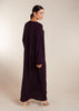 This elegant Two Piece Open Abaya set includes a Full Sleeve matching inner dress. Perfect for everyday wear, it can also be dressed up with accessories for an evening look. The open abaya can be worn as a maxi on its own or paired with the inner dress for a stylish ensemble. In a deep plum purple shade.